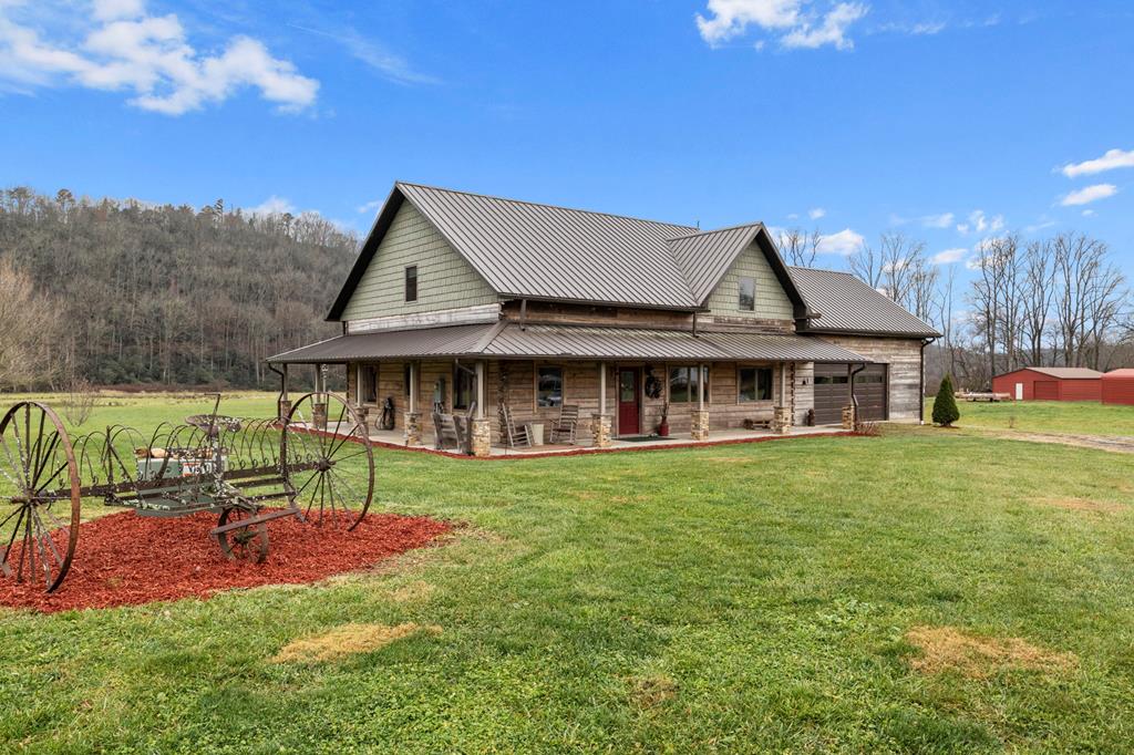 Beautiful Log Cabin by Mastercraft Builders of WNC (Builder's own Home) incl approx 26 acres of prime bottom land. 360 Mountain Views; 1700' Creek Front (Upper Peachtree). 5 add'l outbuildings (2 work shops, 2 barns, hay storage shed). Hay $1,750/yr income. Quality (reinforced rebar in logs, various woods used inside home, standing seam metal roof (strong), garage opens front/back (drive through). Hot tub. 2nd creek that could feed a pond. Development opportunity!! Seller has 3 other adjacent homes (rented) next to the property may be for sale near future. 7 mi to John C Campbell Folks Art School; 24 mi to William Holland Mining Retreat. Peaceful getaway, investment oppt, or both!