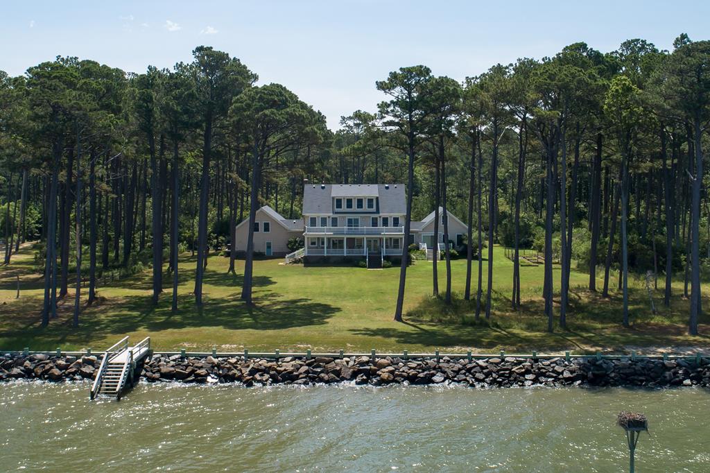 Enjoy expansive views of Chesapeake Bay from the large porch of this beautiful bay front home. The kitchen features maple cabinets, all electric appliances and two extra deep sinks. This house is handicap accessible, including a first-floor suite with full handicap accessible bathroom. Working elevator serves first and second floors. Large work room on the 3rd floor and finished room above the garage. Two walk-in attic spaces on the 3rd floor. Hardwood floors throughout with vinyl in FROG and 3rd story rooms. Standby generator and 400-amp service. Security system and propane heat serving multiple zones. Quality windows and low maintenance siding. Large master bathroom with jet tub, full bathroom serves two other bedrooms on second floor. Hardened bulkhead has been recently maintained.