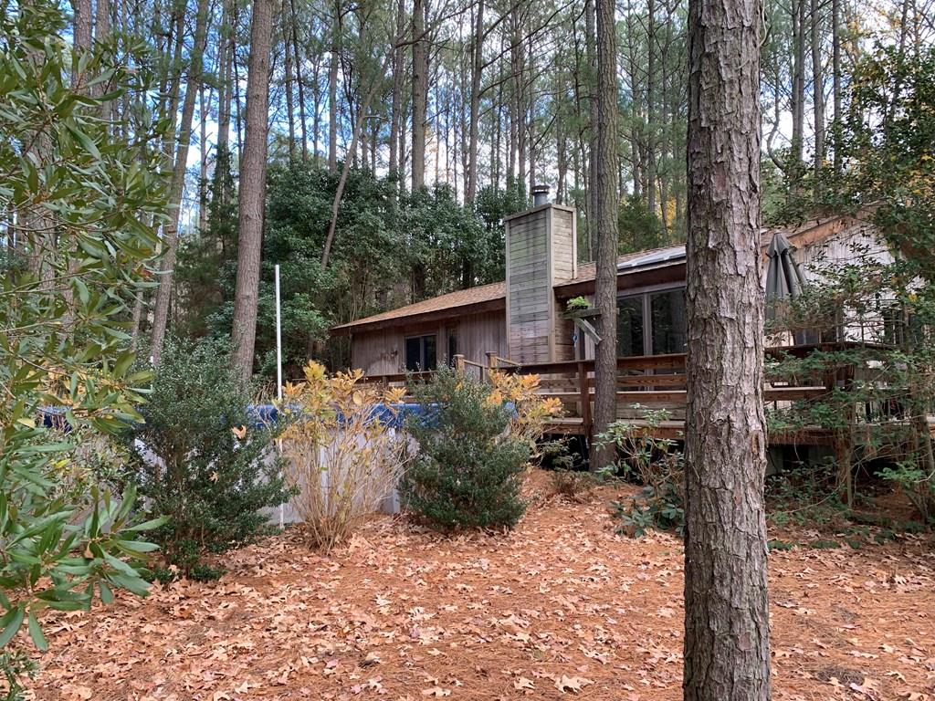 Just 10-15 minutes from the town of Onancock on Onancock Creek.  This home offers a beautiful view of the water and wooded for privacy.  This property has a very well maintained dock with moderate to deep water and is bulkheaded.  The home features 3 bedrooms, 2 full baths, great room, kitchen w/breakfast area, oversized garage w/laundry, deck on 2 sides and an above ground 33 x 18 pool for summer enjoyment.  This property would be a great home for a family, single residence, retirement, or a great air B&B.  The home has just been recently painted and has wall to wall carpet throughout with the exception of tile in bathrooms and kitchen area. The outside of the home is cedar siding w/block foundation. If interested, give me a call for a private showing.