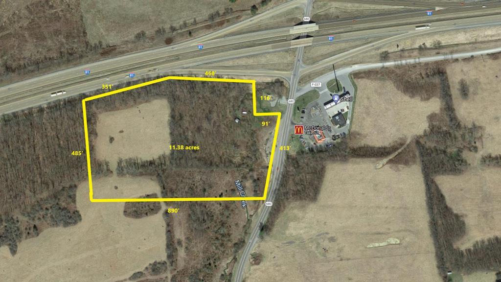 Gently rolling hills on this property located right off of the interstate at exit 60. Over 11 acres total with 50% cleared. Perfect location for commercial use. Restrictions listed on deed.