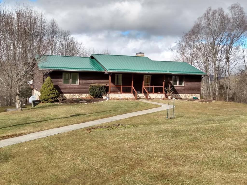 Excellent home on 17.292+/- ac. Seclusion w/long range view & creek w/amazing cascading waterfall. Pond & wooded acreage to roam around. Walk in from the covered front porch into open dining area & living room w/gas log fireplace; windows to enjoy long view; view & sound from the waterfall; & access to open deck which expands entire back of house. Deck is trek flooring, beautiful railings; & stair access to yard. Separate large kitchen w/heated tile floor; island; desk; wine fridge; & breakfast dining area which leads to deck. Large master bedroom w/walk in closet & spacious master bath w/heated tile floor; jet tub; large shower; beautiful cabinetry; & tile work. Main has a 2nd bedroom; laundry closet; & 1/2 bath. Finished basement has spacious family room w/walk out to patio under deck; large bath w/shower w/tile work; kitchen area; 2 extra large rooms 1 w/large walk-in closet. Come view this unique property today & make it your mountain dream home!