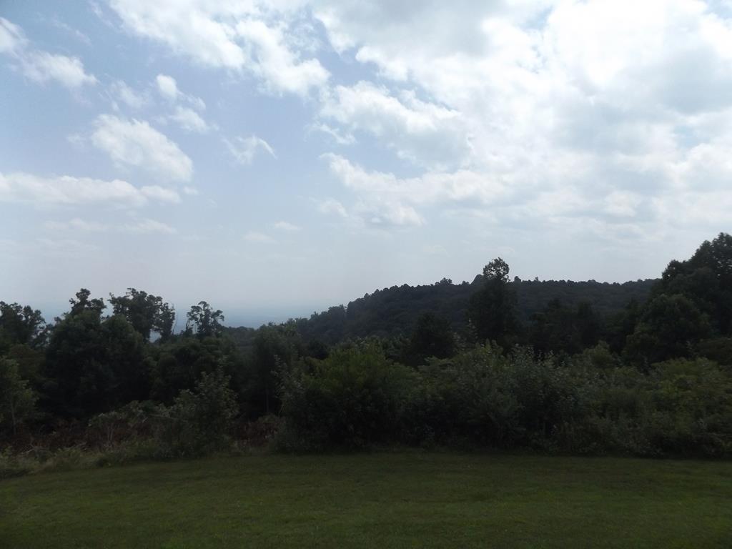 Breathtaking long range Piedmont views with some cutting of trees on this 1.367 +/- acre lot! Property has just been surveyed and perc test approved for an unconventional system! This property is right off of the Blue Ridge Parkway and minutes to Interstate 77! Don't miss out on this building lot with the Piedmont view day and night!