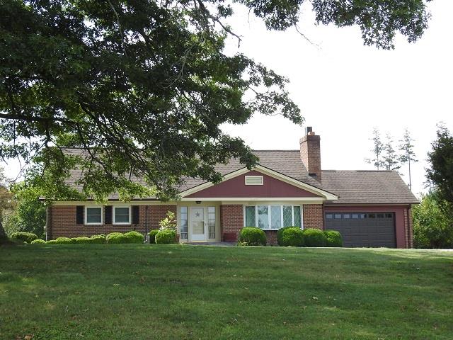 Charming home situated on 10.8 acres in the Woodlawn Community of Carroll County !  Featuring 4 bedrooms, 2 baths, full basement, attached garage and this home comes with some views. Home is well maintained and is being sold partially furnished. Paved circle driveway and convenient to I-77.