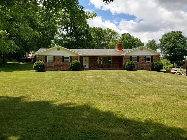 Prime Location! This 5 bedroom, 3 bath home is located in a great community, just off US-58 and close to I-77. This brick home is located on a spacious corner lot and features a large outdoor living space, finished basement with kitchen and would be great for mother-in-law suite, attached 2 car garage and has a newer heat pump but also has propane and a wood stove for back-up. The home has a new roof, underground dog fencing, new hot water heater, and fiber optics have been run to the house but not hooked up. House is hooked to county water but still has well if needed. Would make a perfect home for your growing family!