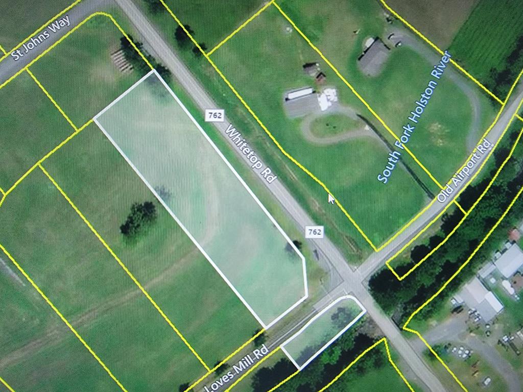 Beautiful home site in Smyth County's prestigious St. John's Crossing with newly built homes. Come build your dream home here!  These quiet lots are out in the country but are only minutes from Interstate 81. This lot is divided by the road and continues across the road on the river with river frontage and access. This lot has road frontage on Route 600 (Whitetop Road) and  Route 762. (Loves Mill Road) St. John's Crossing has underground utilities, paved streets and pastoral views of the mountains. These lots are located minutes from the base of the Iron Mountain, leading up into Whitetop, Mount Rogers and The Grayson Highlands Park Area, where bountiful fishing, hunting, hiking trails, camping and biking are year around treasures.