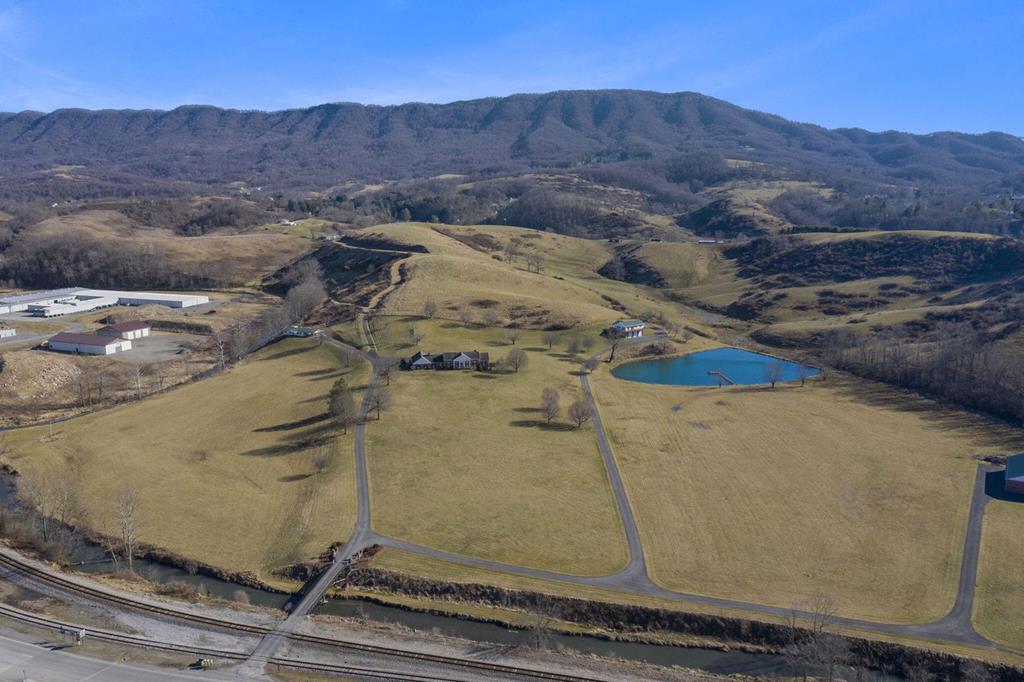 Located in Tazewell Co, Va, within close proximity to the Back of the Dragon and 15-20 min to Bluefield, you'll find this rare opportunity to own acreage along the Clinch River!  In addition, a 1984 1600' 3 bedroom, 1 bathroom home with wrap around porch and 3 bay drive under garage (currently used as a rental) & a separate large 4 bay garage convey. This property would make any outdoorsman or farmer a wonderful forever home. The main house and additional property is for sale and being sold separately, see MLS # 80655 for more information. Main home must sell first.