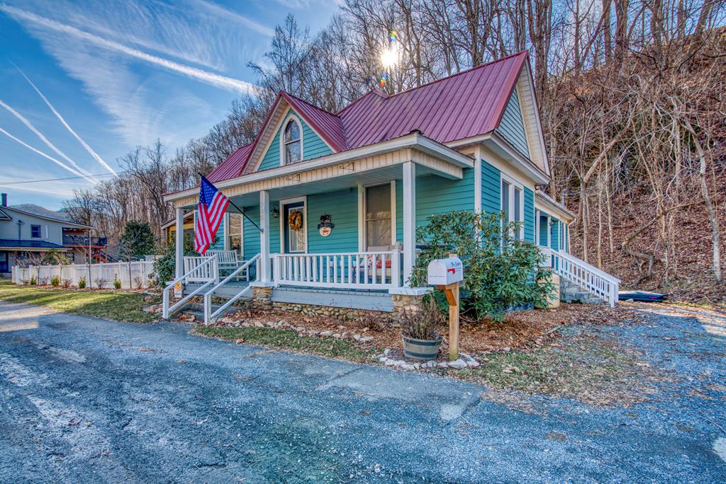 Trail Town USA. Check out this rare opportunity to own a piece of downtown Damascus, VA, the friendliest town on the Appalachian Trail! This historic farmhouse sits on the main street in Damascus, directly across from Laurel Creek, the Appalachian Trail, & the Virginia Creeper trail. The home is currently a residence, but is zoned BOTH COMMERCIAL & RESIDENTIAL. It also features a level DOUBLE LOT that could be used to build another home or business. Enclosing the yard is a beautiful vinyl fence. This well maintained home has had many recent updates including the kitchen, bathroom, master bedroom, & laundry room.  Kitchen features granite countertops, a butcher block island, & an apron front sink. Other features of the property include a newly built large back deck, screened in porch, new kitchen appliances, & new furniture throughout the entire house. The property is within walking distance to local amenities such as shopping, restaurants, parks, & trails.