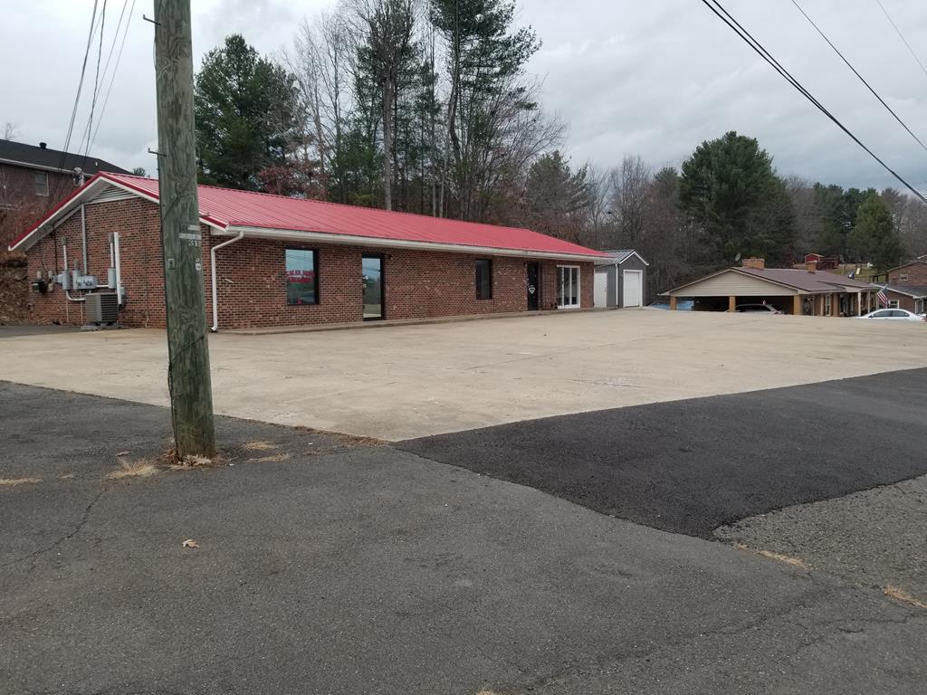 LOCATION, LOCATION, LOCATION - GREAT COMMERCIAL LOCATION BETWEEN GALAX AND INTERSTATE 77. THIS PROPERTY FRONTS US HWY 58 AND SHADETREE LANE WITH EXCELLENT EXPOSURE ALONG US HWY 58. THE PROPERTY IS AT AN INTERSECTION AND CAN BE ACCESSED FROM BOTH AN EASTERN AND WESTERN DIRECTION FROM US HWY 58.  2,400 SQ. FT., ONE STORY BRICK COMMERCIAL BUILDING IN GOOD CONDITION, CONSISTING OF OFFICE SPACES, RETAIL AREA, THREE BATHROOMS, AND BREAK ROOM. THIS BUILDING CAN BE UTILIZED AS ONE LARGE COMMERCIAL SPACE OR SEPERATED INTO THREE DIFFERENT SECTIONS TO MAXIMIZE RENTAL INCOME DUE TO HAVING THREE ELECTRICAL METERS. HEAT PUMPS PROVIDE HEATING/COOLING AND PLENTY OF ONSITE PARKING IN THE FRONT AND SIDE. IF YOU'RE LOOKING FOR A GOOD COMMERCIAL BUILDING AND LOCATION FOR YOUR BUSINESS, DON'T LET THIS ONE GET AWAY!