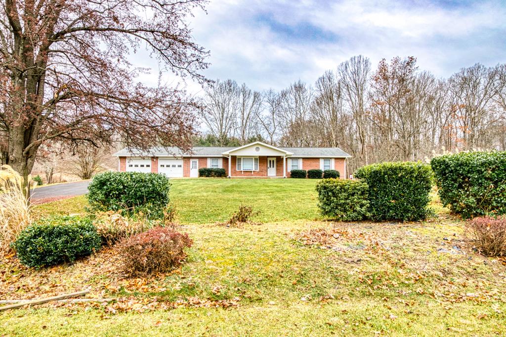 Are you looking for one level living in an established neighborhood in Wythe County?  Well you've found it! This spacious 3 bedroom 2 and a half baths ranch is all you need and more. This home has a two car garage with one oversized bay that can hold large vehicles or a boat. The large backyard has an outbuilding and is perfect for the kids and pets to play. The deck off the kitchen/dining area is perfect for backyard cookouts and entertaining. The master bedroom has his own bath and the dining room has a vaulted ceiling and a centrally located wood burning fireplace. The living room has a bay window and enough space for the whole family to hang out. Laundry on the main level makes this one level living at its finest. The enormous basement is wide open and could be made in to virtually anything - man cave, home theater or more living space. This is the only home available in Ashley Oaks. Call for your showing today!