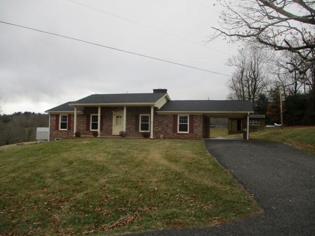 Less then 2 miles from the scenic Blue Ridge Parkway is this brick ranch house.  Beautifully landscaped with a large oak tree in front and stunning view out back through the sliding glass patio door.  Paved driveway with turn around.  Attached carport.  Full walk out basement adds additional 1512 sq. ft.  Shed in the back for all your garden needs.  Do not miss this Pipers Gap beauty!