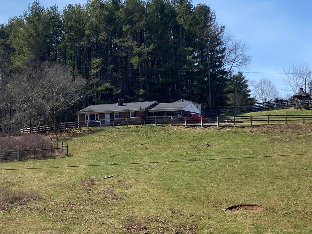 Country charm in the City of Galax! This  3 bedroom, 1 bath, brick home with 9 acres would make someone a perfect mini farm with good pasture and fencing. Convenient to downtown Galax, schools and shopping.