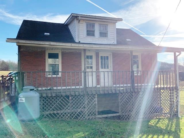2 Bedroom, 1 bath, 922 sq.ft. Brick Farm House. An approximate 250 additional sq. ft. upstairs that could be finished for additional bedroom(s). Property features some Harwood flooring, 672 sq. ft. unfinished Basement for storage, 168 sq.ft. front covered Porch, for relaxing, and an Outbuilding...all on 1.06 acres.