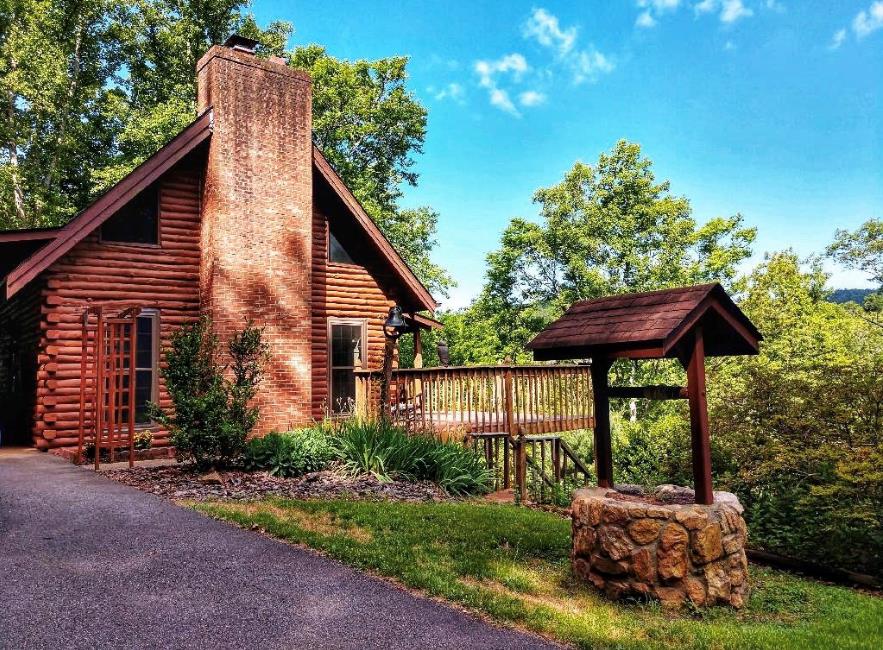 Rare find! A log cabin with deeded Mayo River access located in the town limits of picturesque Stuart Va, at the foothills of the Blue Ridge Mountains. From the wrap-around deck, youll enjoy a view of the mountains and the (trout stocked) North fork of the Mayo River. Inside youll find the kitchen, Great Room, and dining area included in an open floor plan and 20 cathedral ceilings, & 6ft windows in the great room. Also, a bedroom and full bath are on the main level. Upstairs there is a loft area that could be used for a 3rd bedroom, but is currently used for office space. There is also another bedroom upstairs. Ceilings are cathedral style, with tongue and groove boards.The house boasts hardwood, laminate, and new luxury vinyl plank flooring. The basement has curtain partitions and luxury vinyl to create extra sleeping space. This home would be a great permanent home, vacation home, or Airbnb. Outside there are various flower beds, a bird bath, stand up heater, a hammock, outdoor