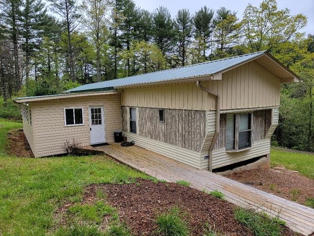 GREAT LOCATION JOINING THE BLUE RIDGE PARKWAY AND WITHIN WALKING DISTANCE THE BLUE RIDGE MUSIC CENTER! VERY NICE FULLY FURNISHED & REMODELED 1,358 SQ. FT. MOBILE HOME IN A PRIVATE SETTING SITUATED ON 2.6 ACRES. FEATURES INCLUDE: NEW 14' X 32' SUNROOM WITH NEW MINI-SPLIT HEAT PUMP, NEW 3-TON HEAT PUMP IN THE MAIN LIVING AREA, NEW APPLIANCES, NEW FLOORING THROUGHOUT, NEW ROOF SYSTEM AND NEW 12' X 24' COVERED FRONT PORCH. ADDITIONAL MOBILE HOME FOR STORAGE OR WITH A LITTLE WORK WOULD MAKE A IDEAL AIR-BNB RENTALS. GREAT PLACE TO GET-A-WAY FROM ALL THE  HUSTLE AND BUSTLE! CALL TODAY!