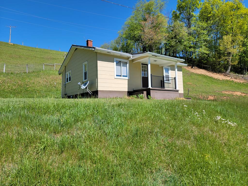 Cute starter home with updates inside. Sit on your small porch and listen to the creek run in your country get-a-way. Surrounded by beautiful farmland and mountain ridges.