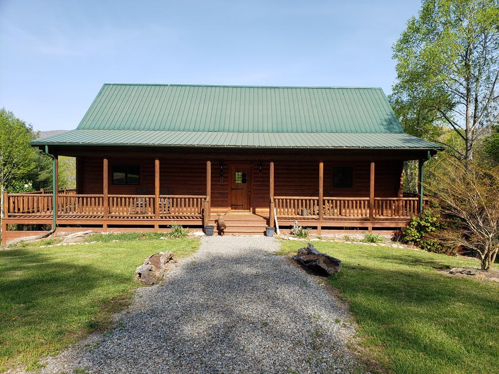 54 acres and Log home with Extensive frontage on Big Wilson Creek and View of Mount Rogers. 5 bedrooms, 3 and1/2 baths, nice barn, mature timber,  wrap around deck, generator, Star Link internet, very close to Grayson Highlands Park, Jefferson National Forest and the New River.
