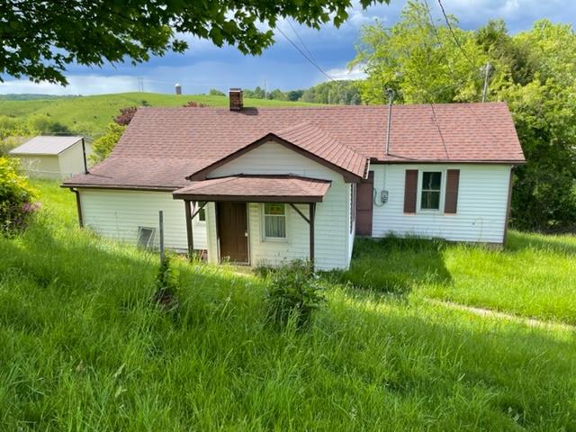This country charm fixer-upper home is being sold AS-IS. Calling all flippers or visionaries! This home can be yours for 85,000. Sits in the town of Hillsville. Siding has been put on in the last ten years (per owner) and roof as well (per owner) Some windows have been replaced but not all.  Come make an offer! The land is approximated between .75 to 1 acre, but no current data.  The tax value is 76,000 on this one and is in 9 lots that sit together.
